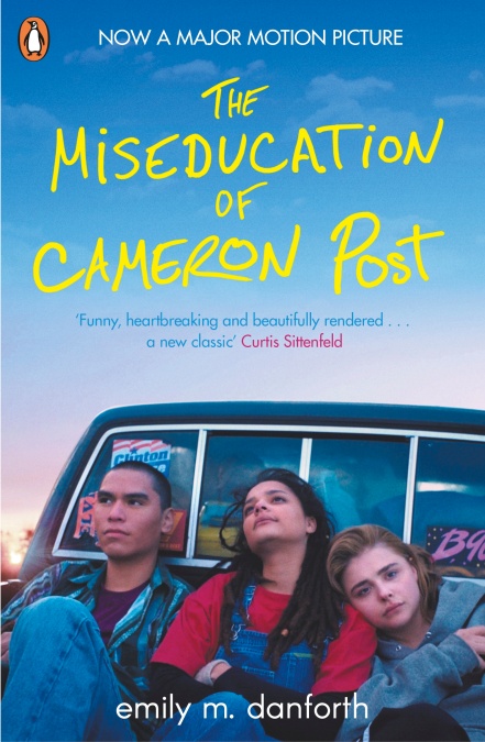 Book cover of The Miseducation of Cameron Post, featuring three teens sitting on the back of a car