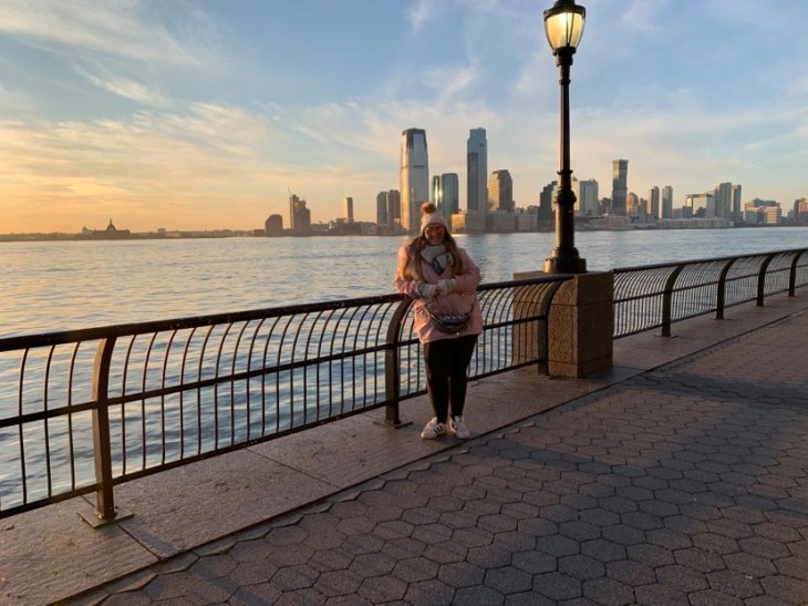 Woman poses on a bridge in New York