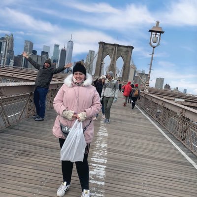 Girl stands on a bridge in New York