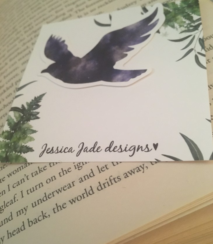 purple bird bookmark on a book