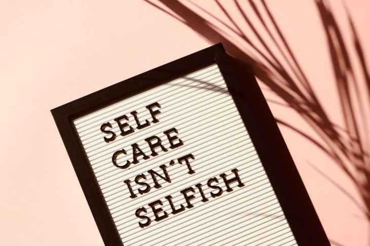 A poster that says "self care isn't selfish".
