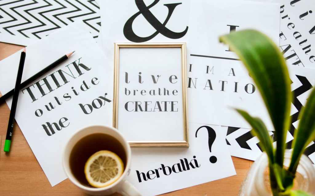 A mixture of motivational quotations and posters, such as "Live Breathe Create".