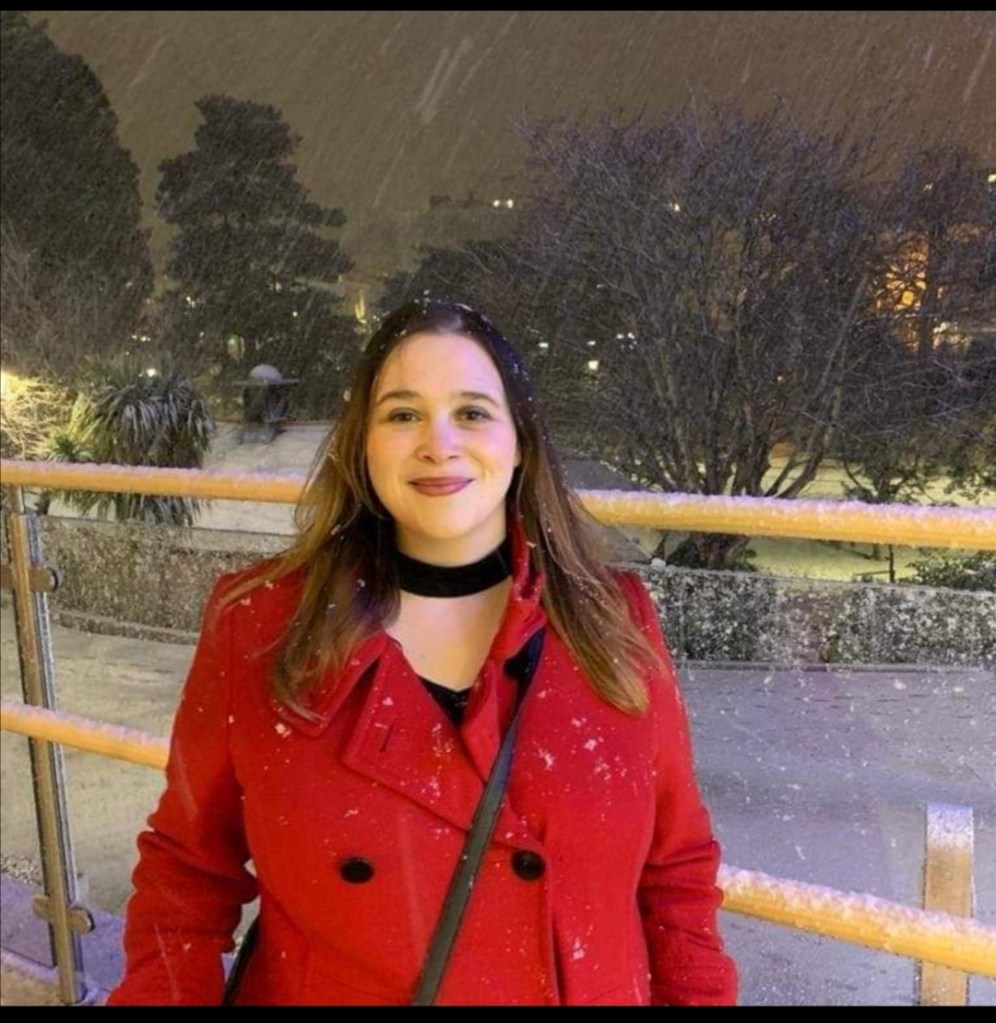 Woman stands in the snow