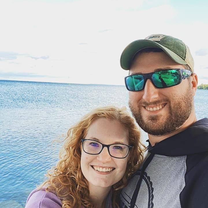 Man and woman pose for the camera.