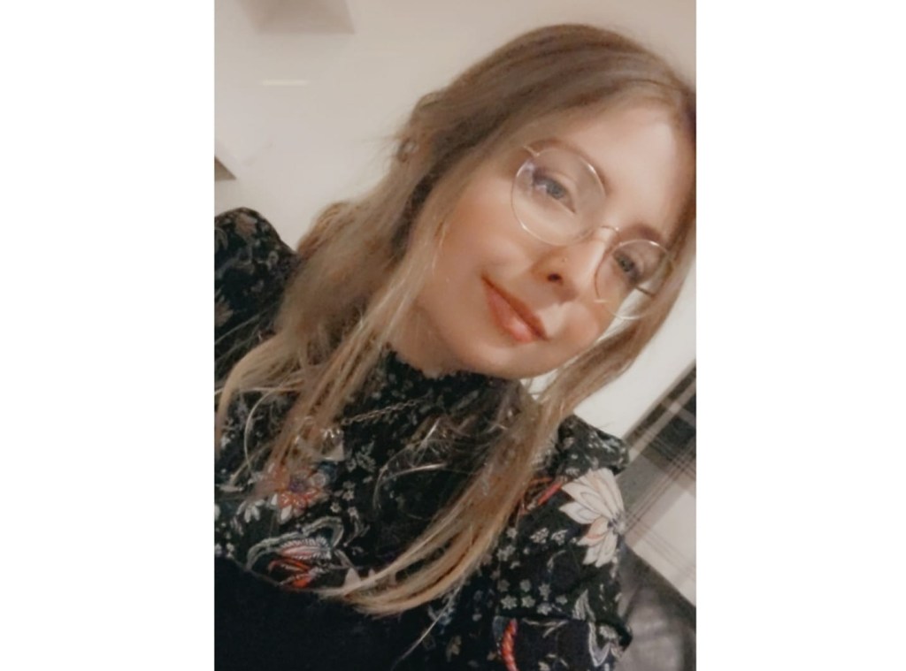 Selfie of a young woman, wearing glasses