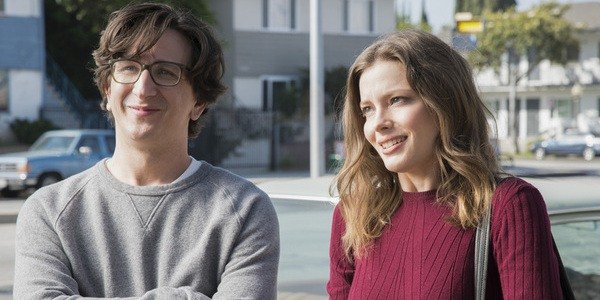 Mickey and Gus from the Netflix series 'Love' laugh and stare into space.