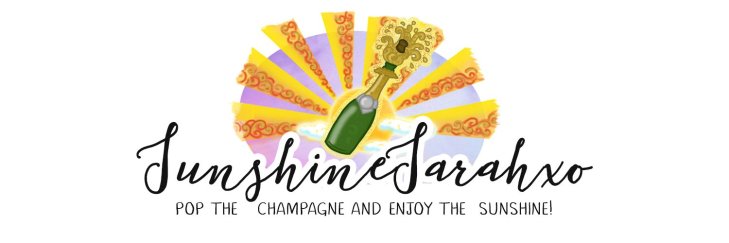 A slogan from the "Sunshine Sarah" blog, reading "Pop the champagne and enjoy the sunshine".