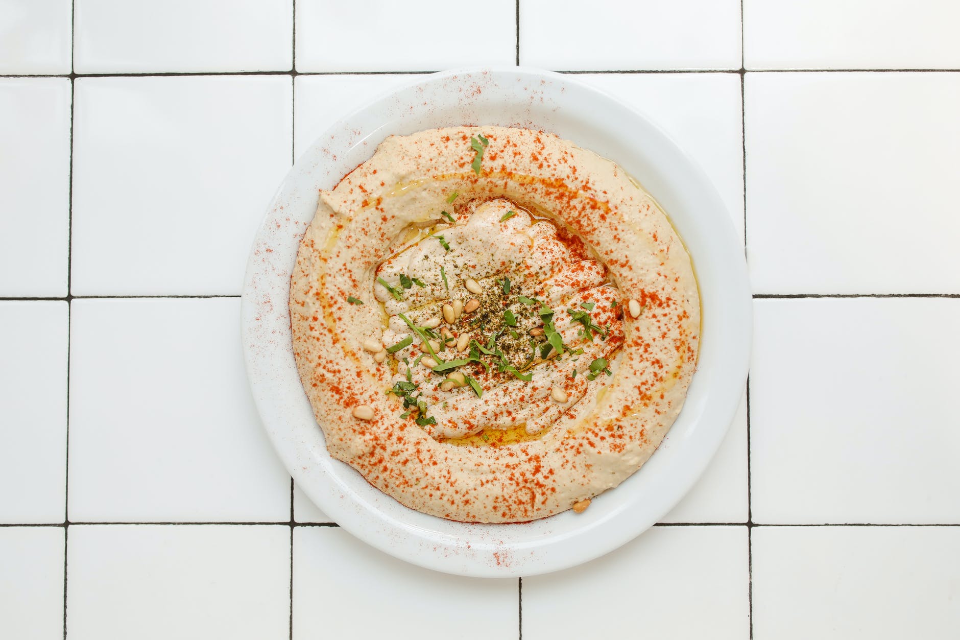 Close-up shot of a hummus snack on a plate