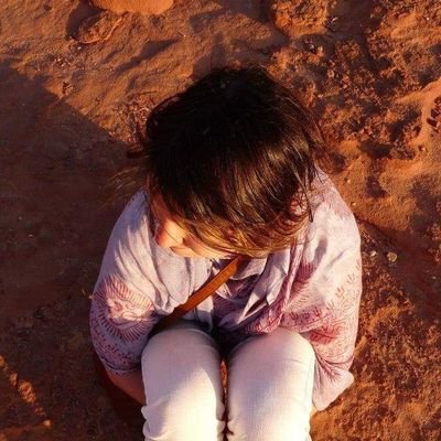 person sat on sand