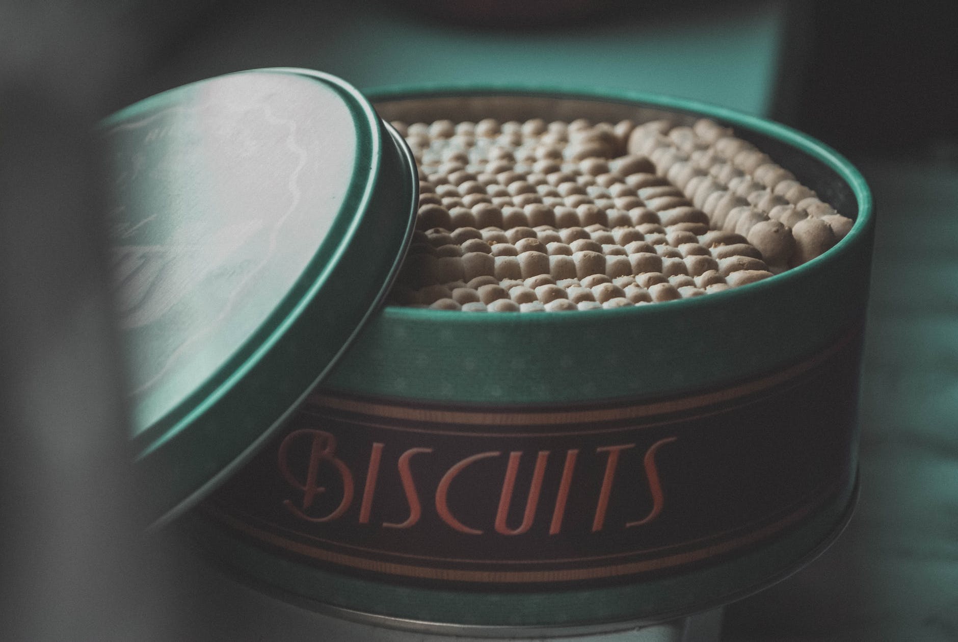 green steel container with biscuits- Bake-Off treats