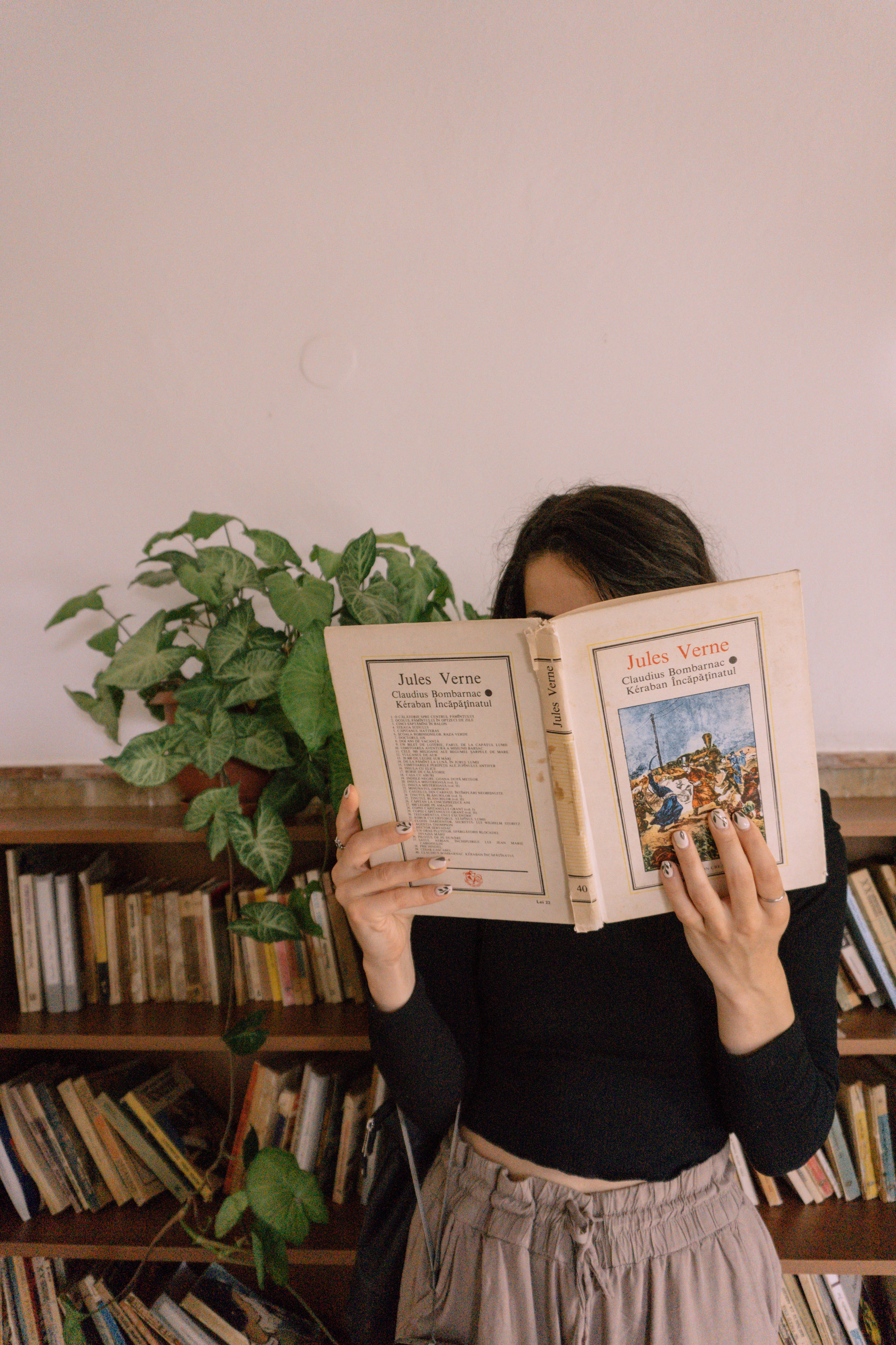 person reading Jules Verne