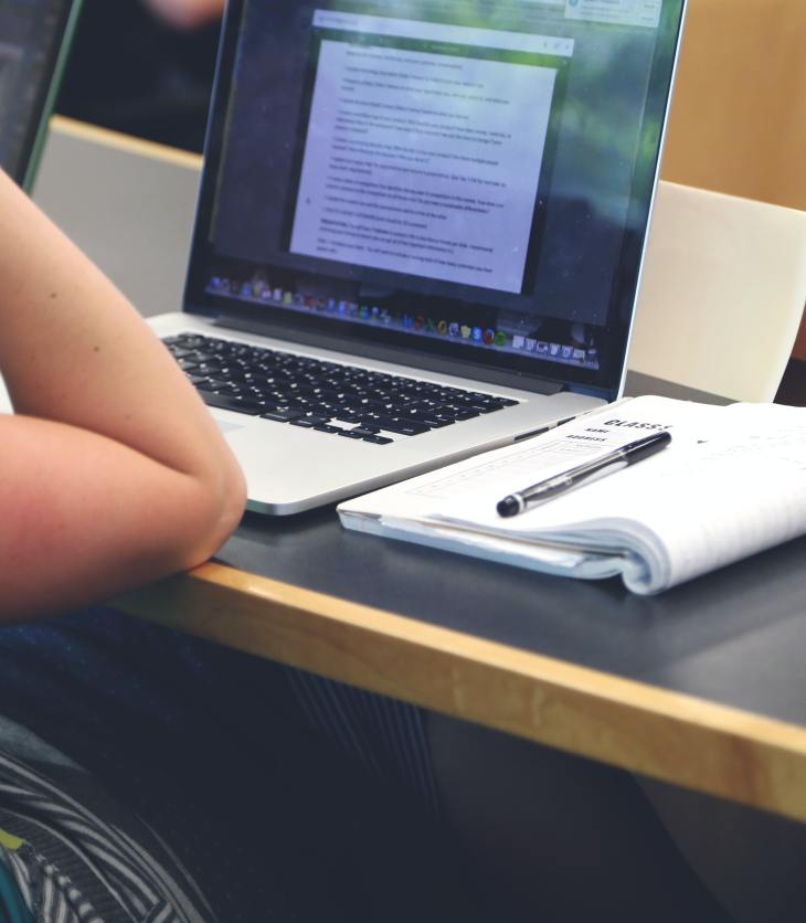 person at a laptop, completing an internship application