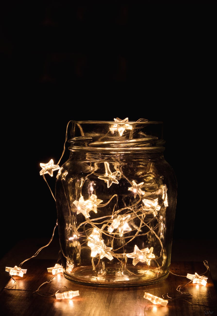 clear glass jar with string lights