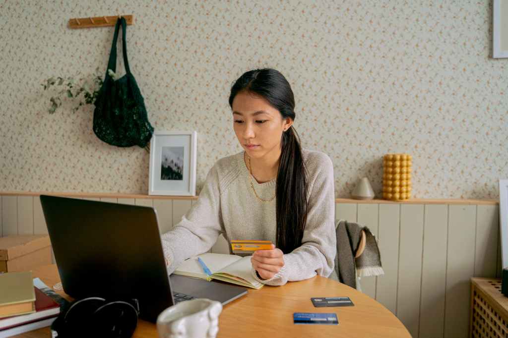 woman in grey sweater working from home