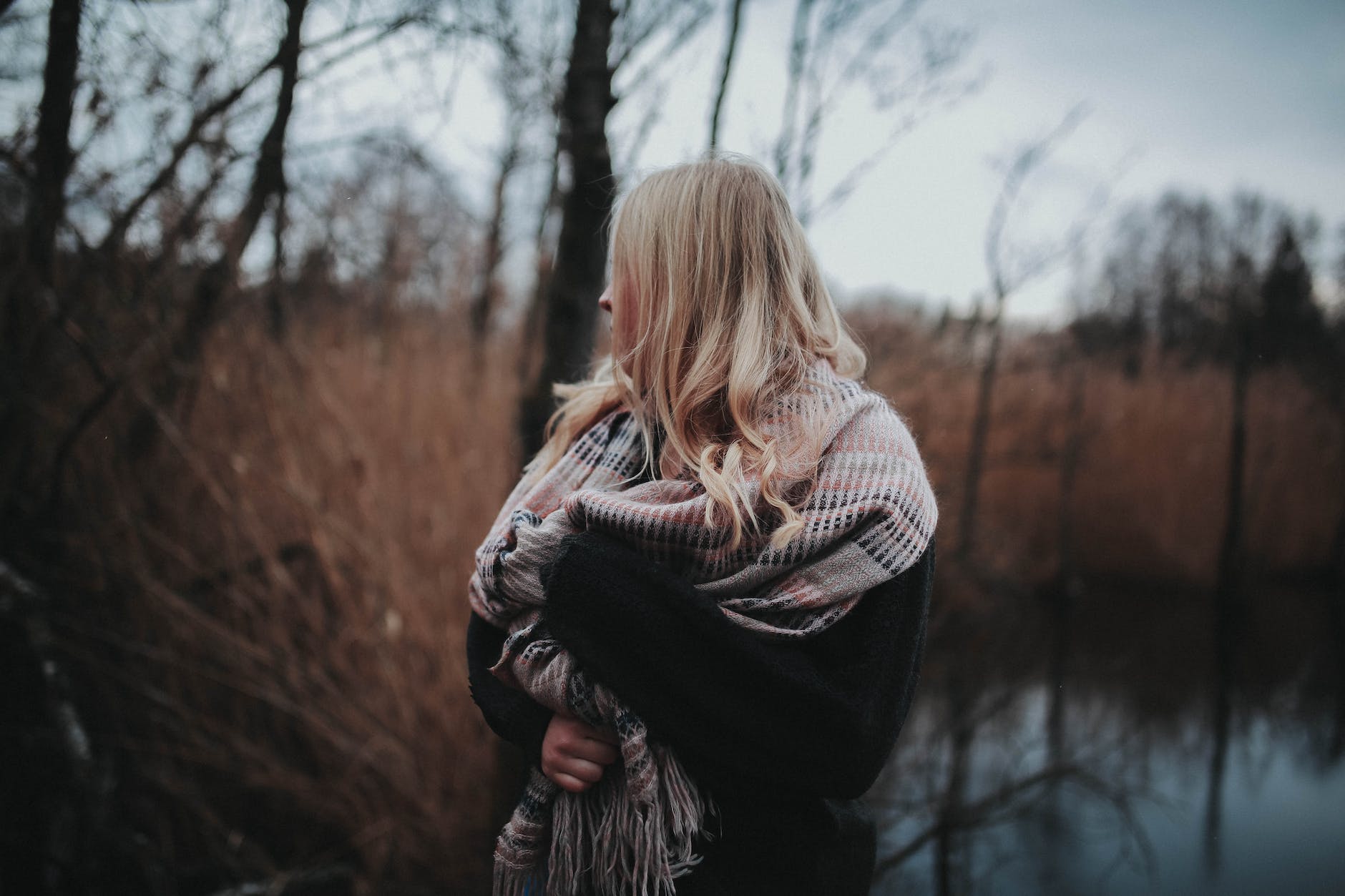 woman wearing black coat and white scarf