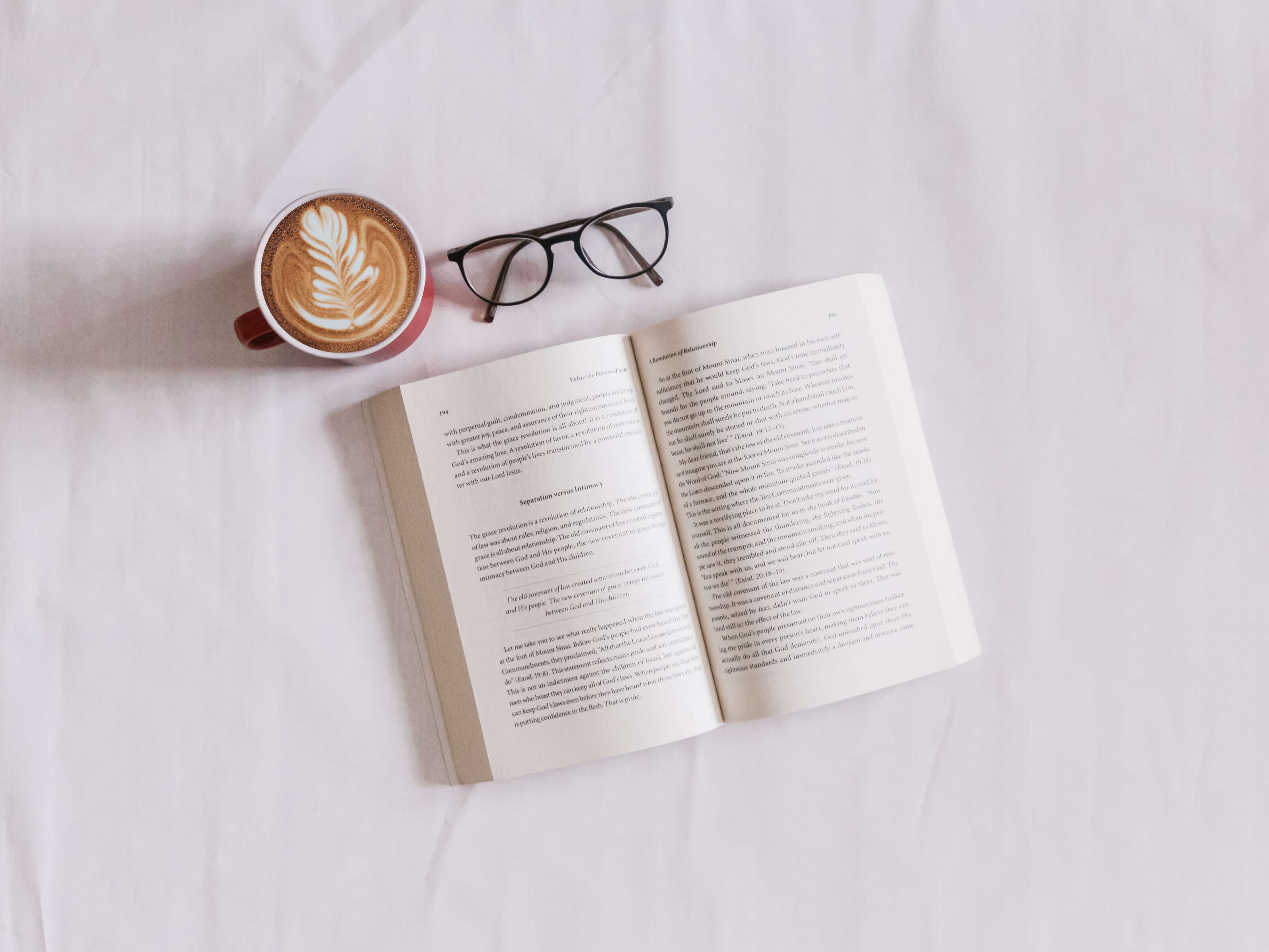 open book with coffee mug and glasses: writing activities for writers