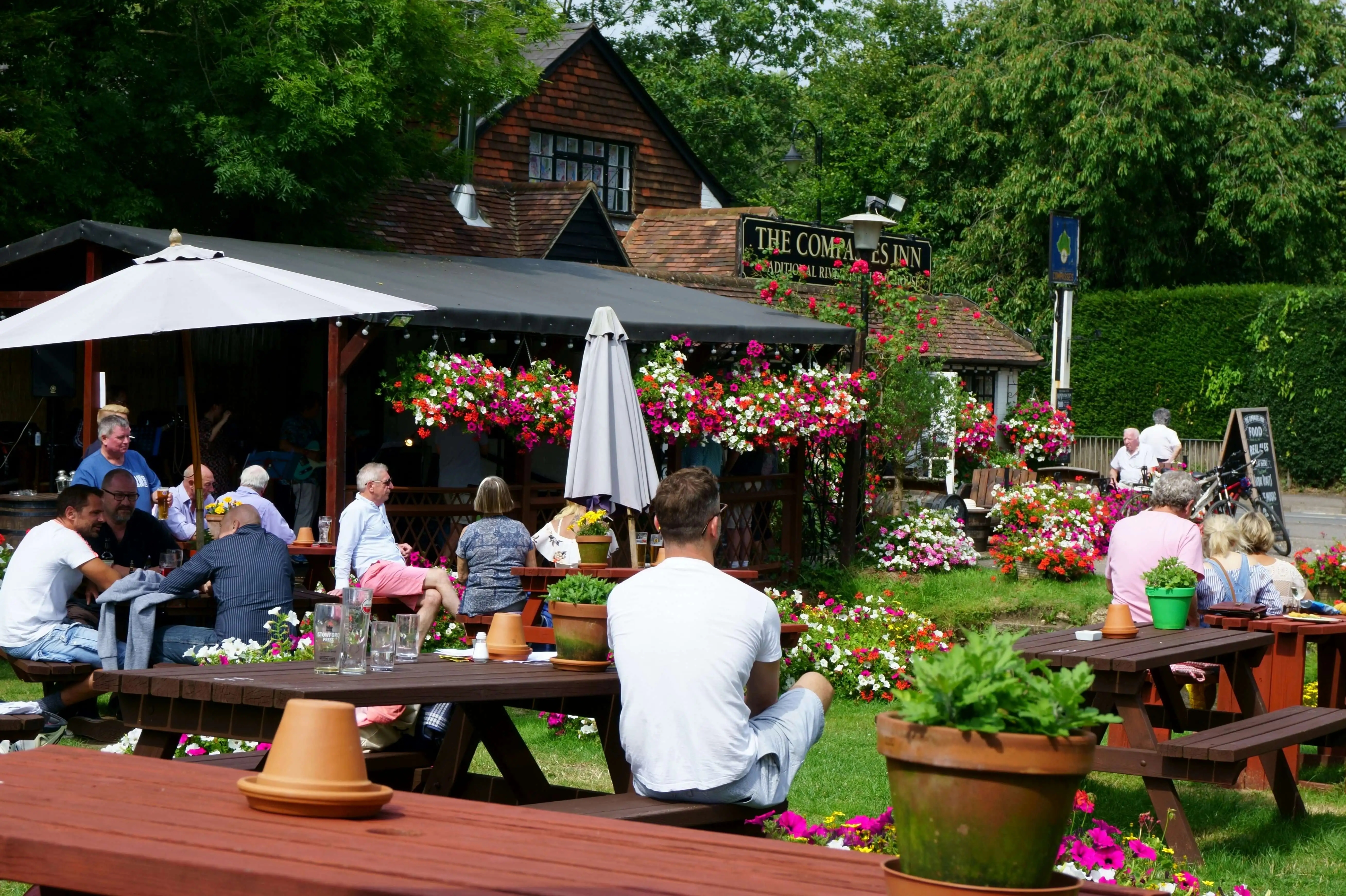 people sat in a Summer pub garden