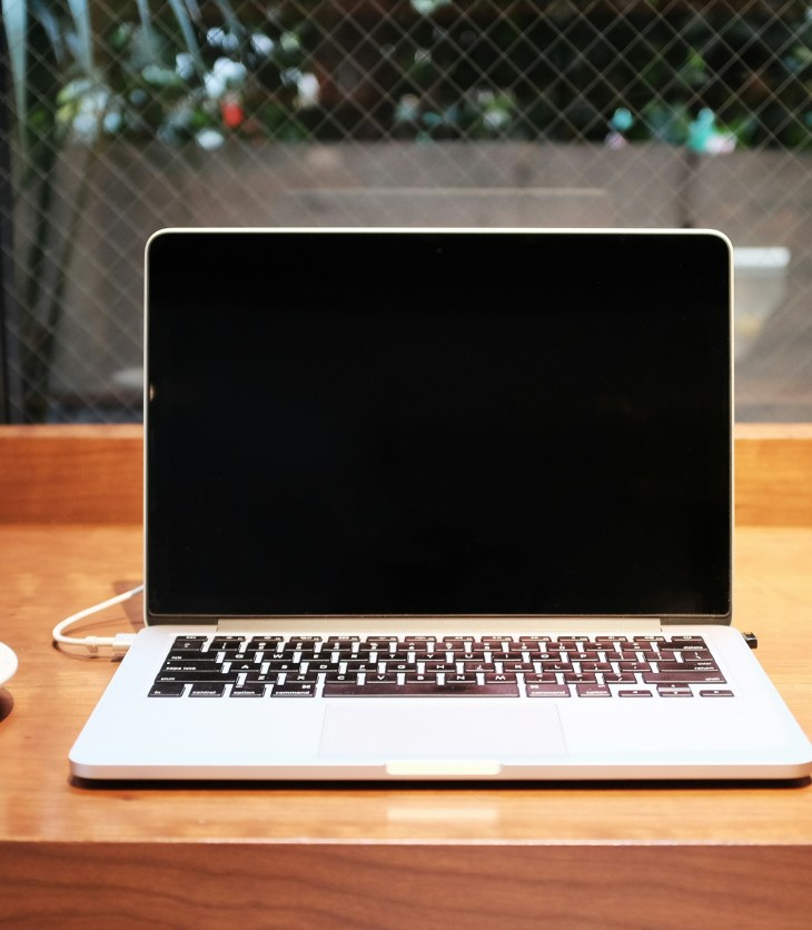 laptop with a cup of coffee next to it: how to find freelance clients without using social media