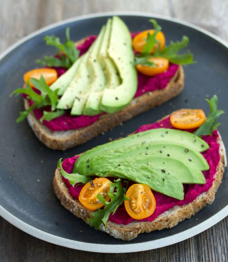 avocado slices on toast with tomato