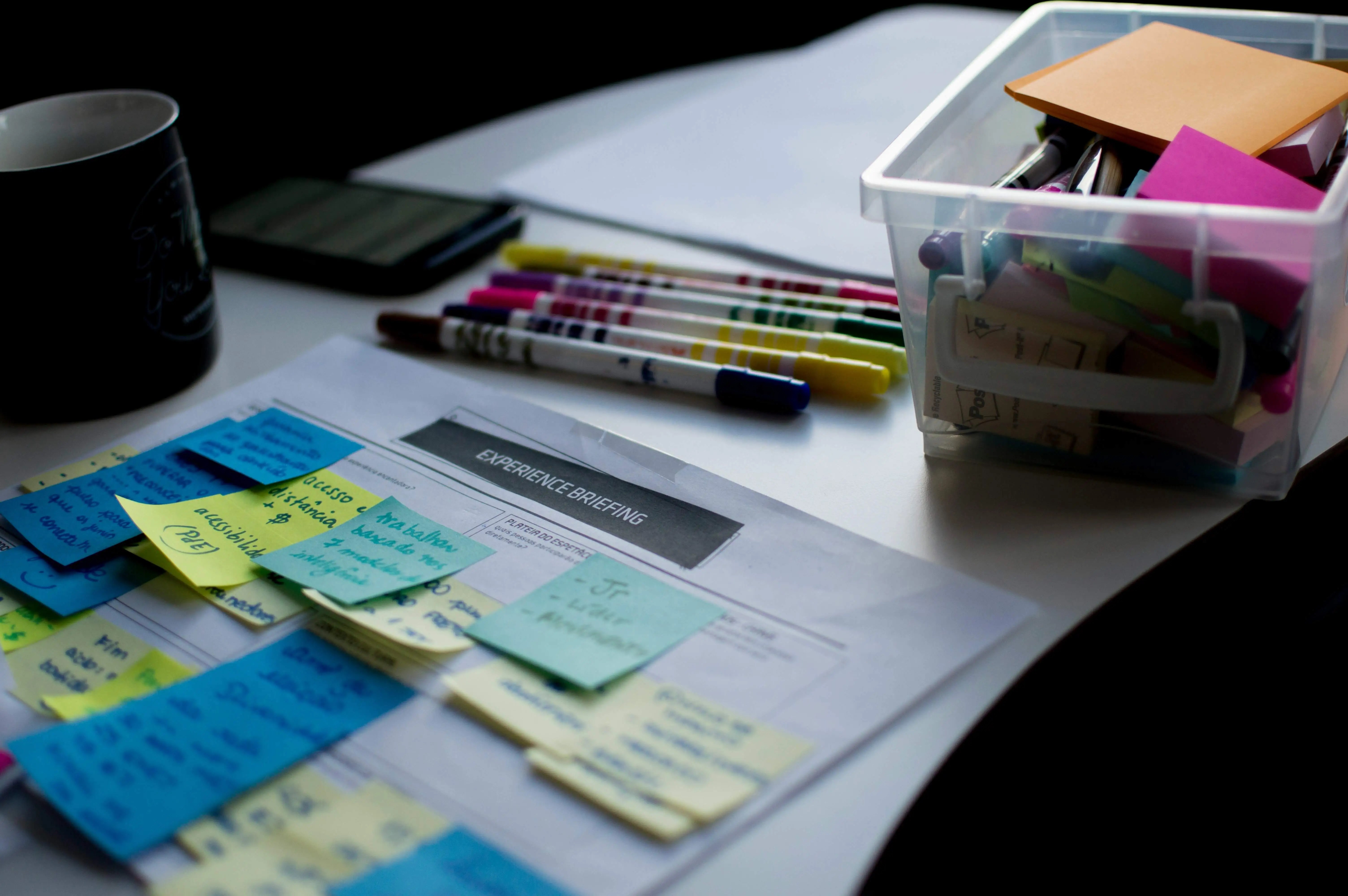 marker pens with a paper diary and post-it notes: ways to find freelance clients without using social media