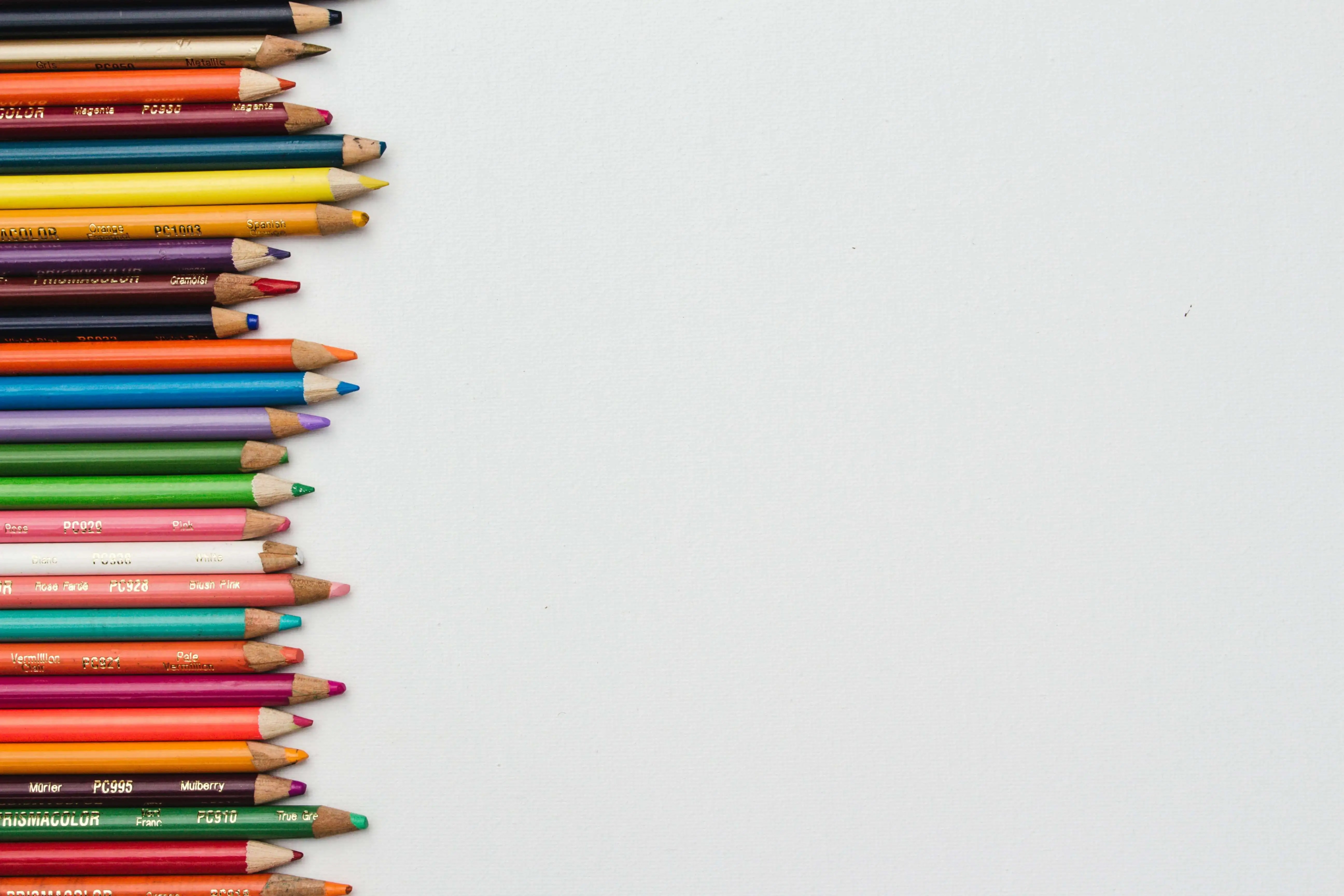 crayons lined up on the left side of the image: start your freelance writing portfolio