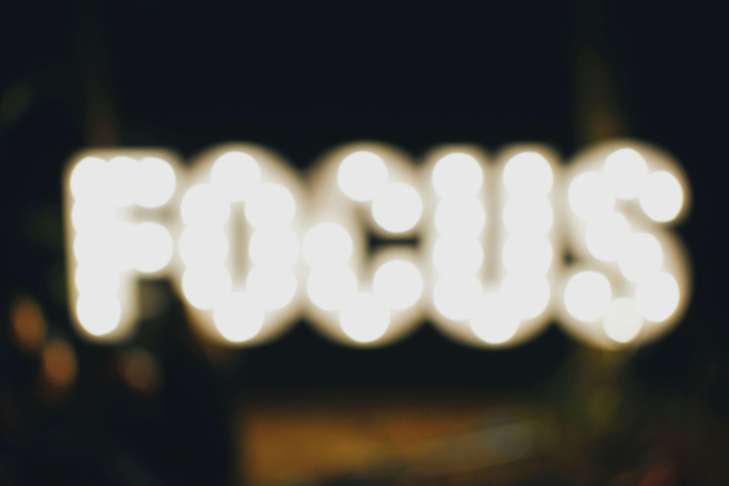 neon lights that spell out "focus"