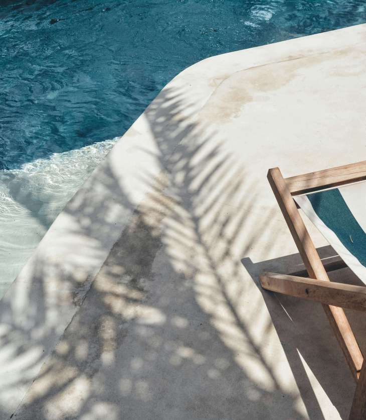 deck chair on the side of a pool