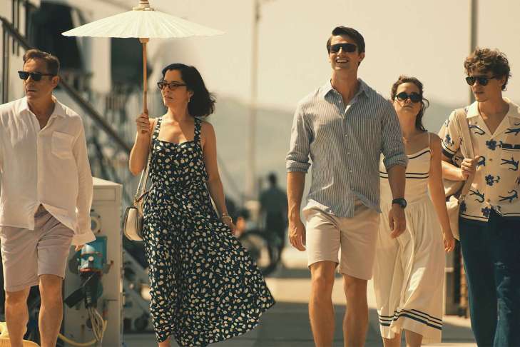 still from white lotus 3 - well-dressed wealthy people walking down a street